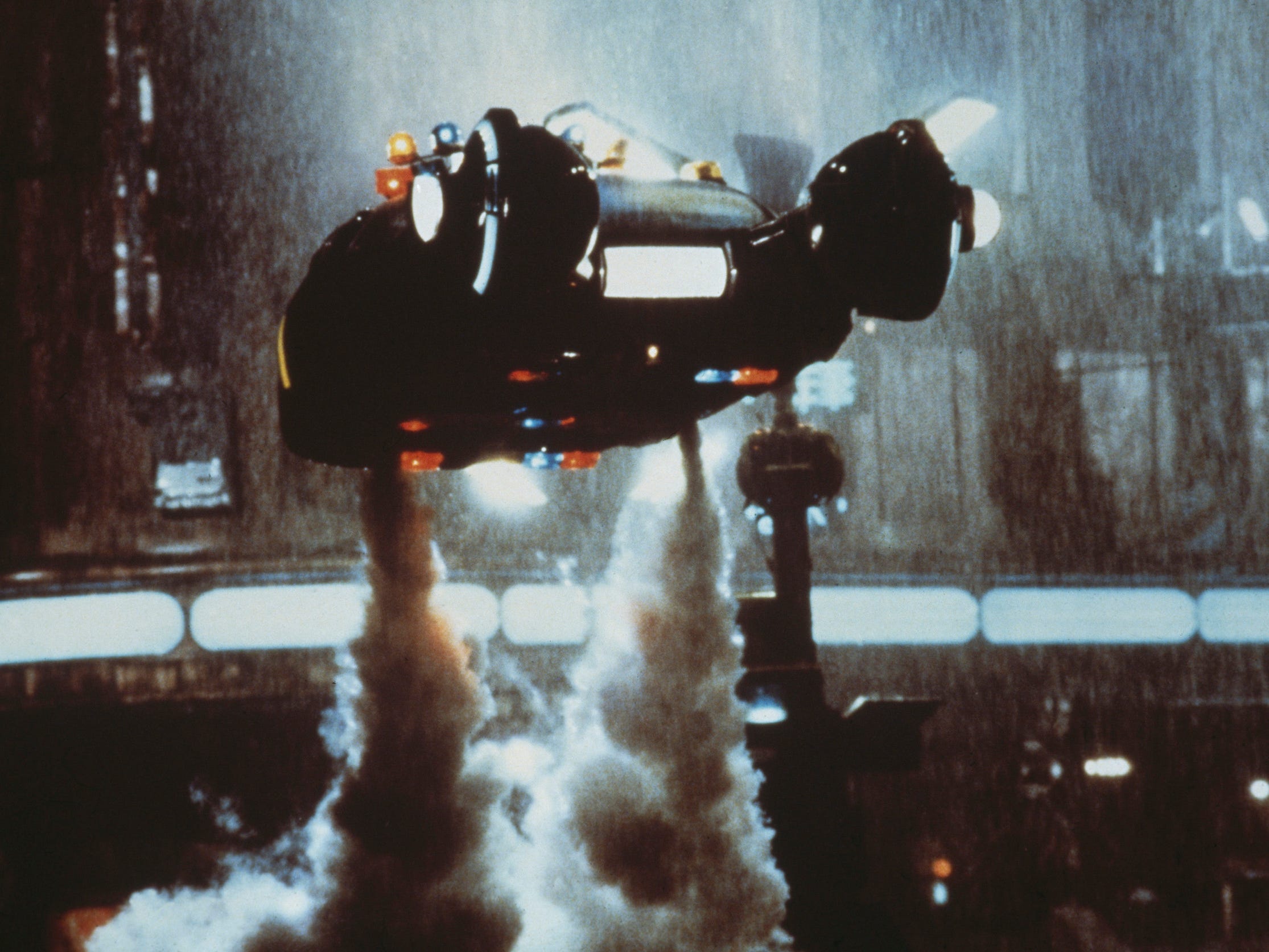 A 'Spinner' flying car takes off in a scene from Ridley Scott's futuristic thriller 'Blade Runner'