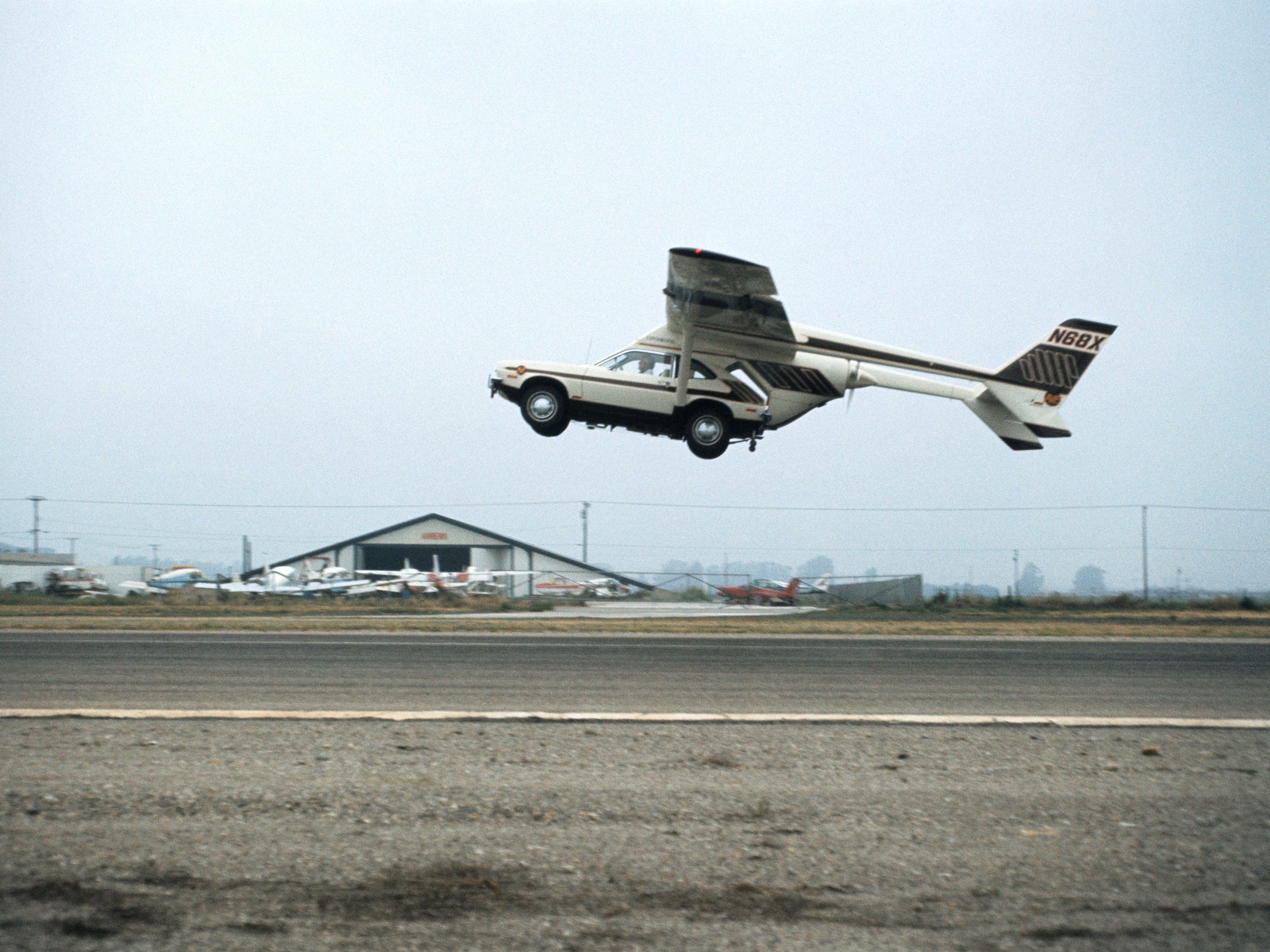 The AVE Mizar taking flight on an airport runway